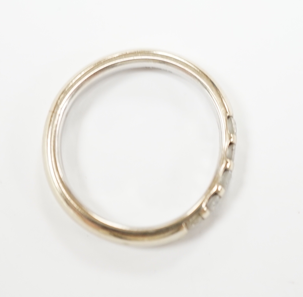 A modern 18ct white gold and five stone diamond set half hoop ring, size J, gross weight 3.6 grams.